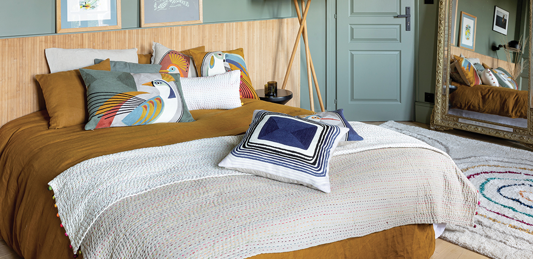 Decorative and colourful patterned cushions with plaids and high quality bed linen Vivaraise